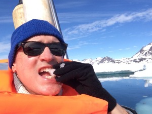 Eating fresh iceberg to numb the pain of rude tourists. Mmmm, tastes like Evian!